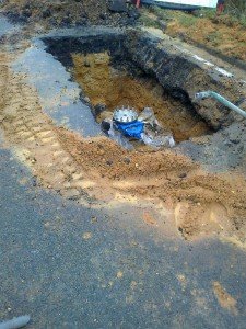 Blue control valve under surface of road