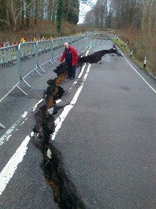 Peter Biggs standing next to the crack