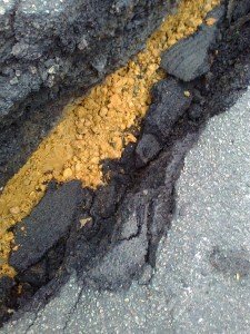 Gravel in road crack