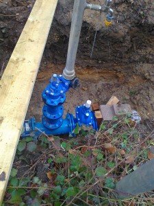 Blue control valve under surface of road
